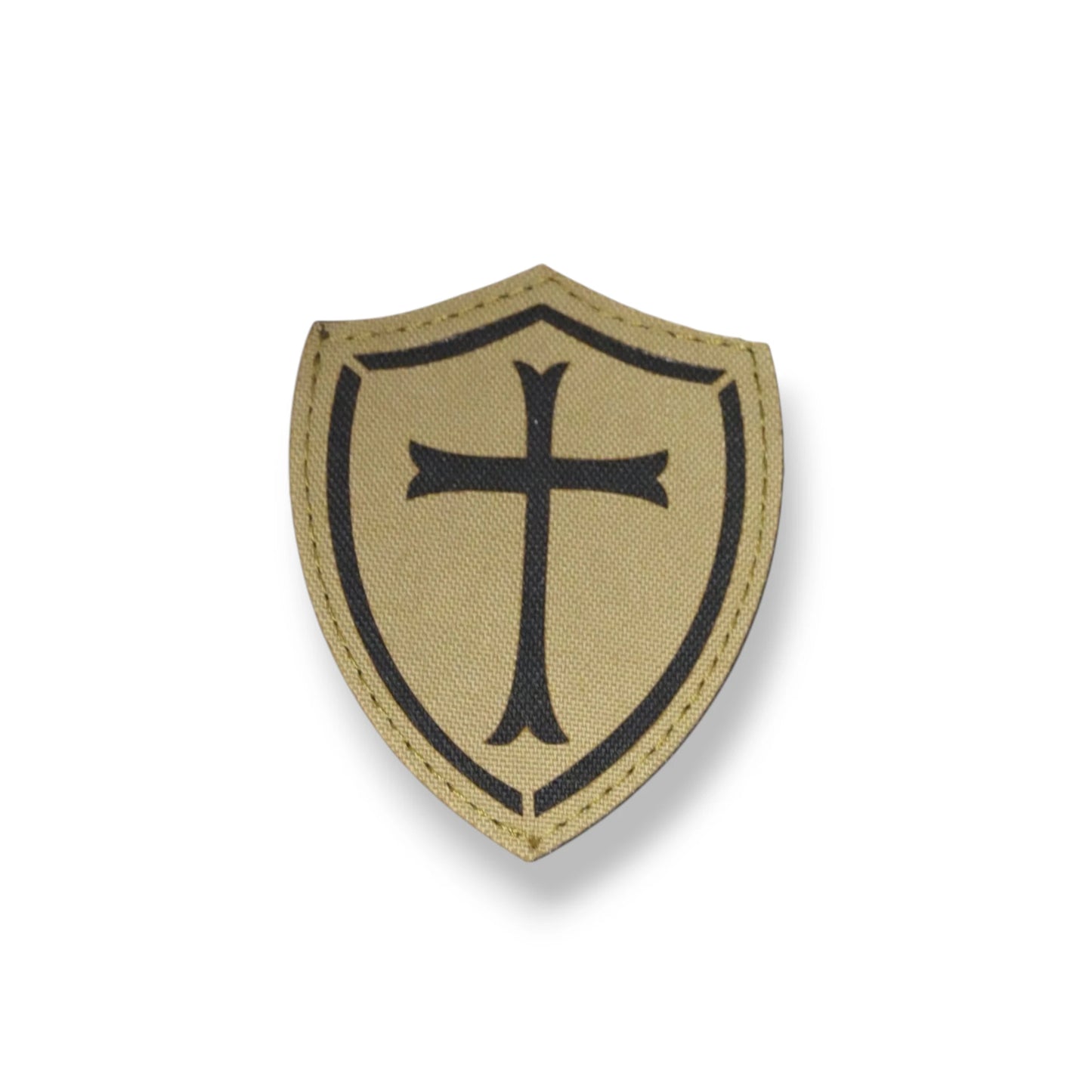 Beige shield patch with black cross on a white background