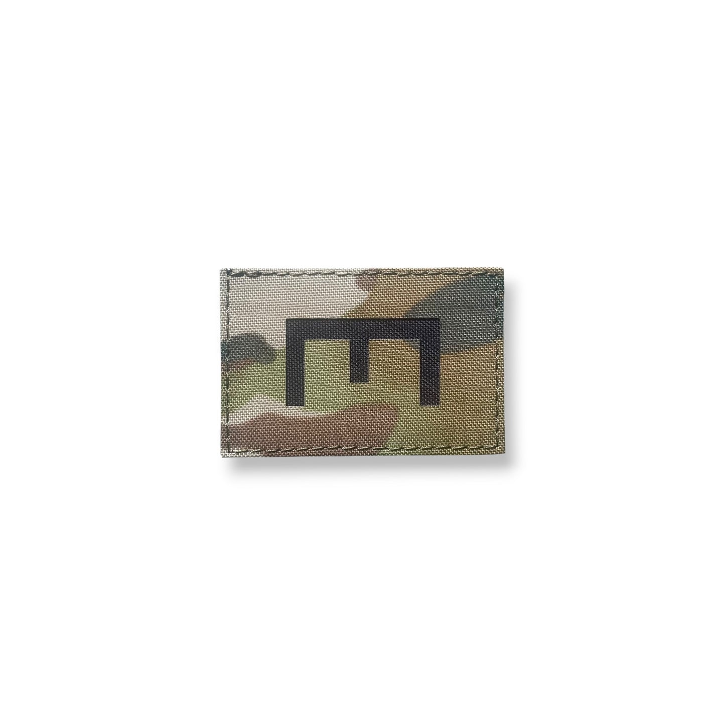 Multicam patterned patch with a black logo on a white background