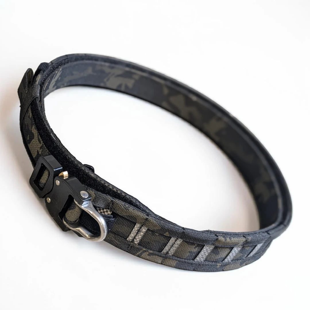 Multicam Black Peregrine Battle Belt black buckle on a white background.
